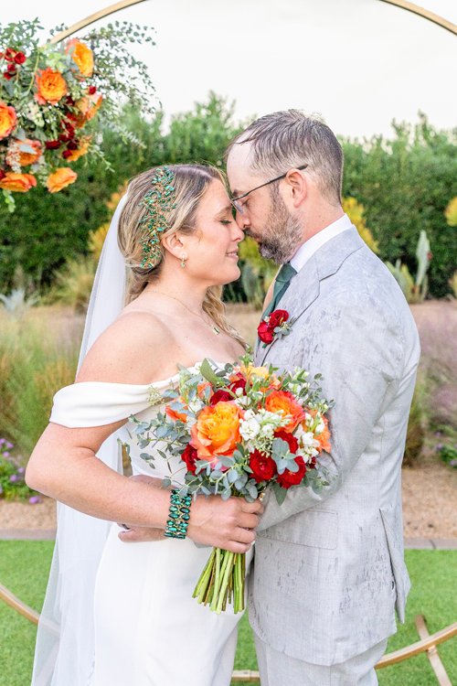 Bride and groom portrait in front of modern cactus wall at Andaz Scottsdale wedding venue