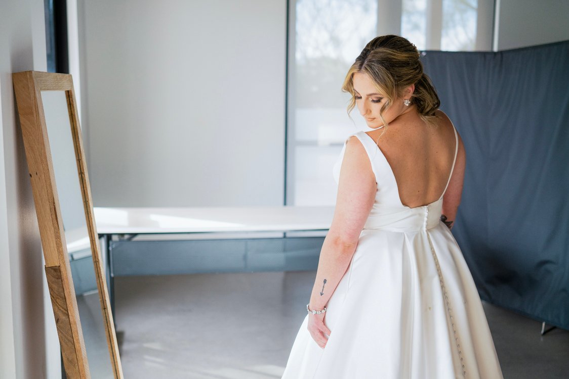Bride and groom embracing with colorful bouquet at Andaz Scottsdale wedding