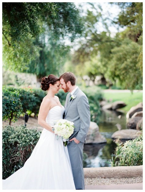 Outdoor wedding ceremony at the Fairmont Scottsdale Princess with flower-lined aisle