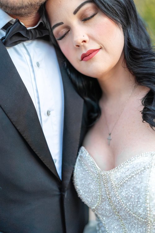 Arizona wedding photographer capturing a close-up bridal portrait with elegant gown detailing.