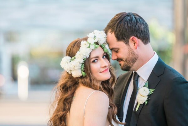 Bride and groom outdoors with flower crown